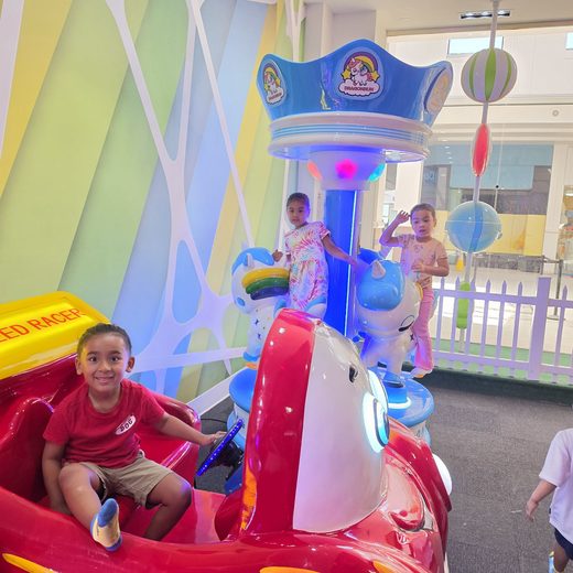 Roman in the racer car with friends